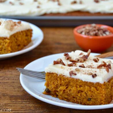 A slice of the best Pumpkin Bars with Cream Cheese Frosting on a white plate