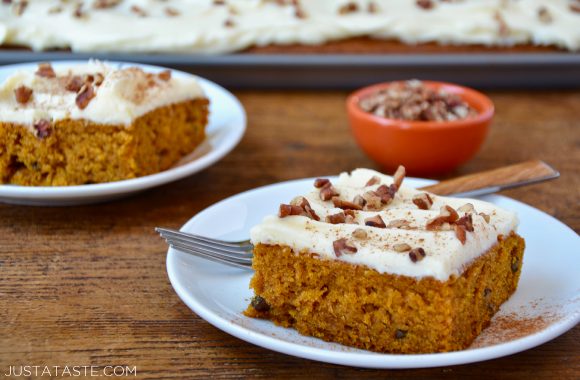 A slice of the best Pumpkin Bars with Cream Cheese Frosting on a white plate
