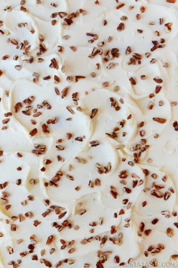 Cream cheese frosting sprinkled with chopped pecans