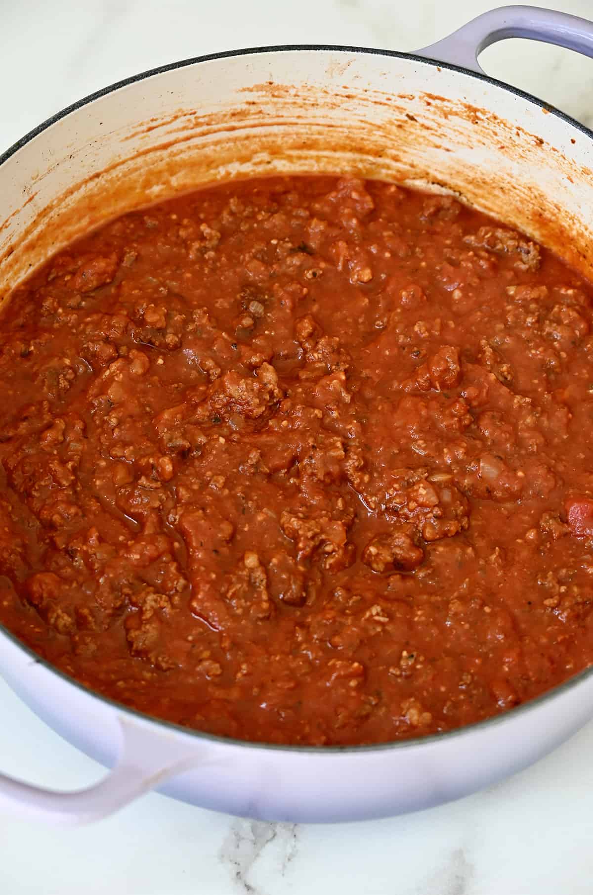 Meat marinara sauce in a heavy-bottomed stock pot.