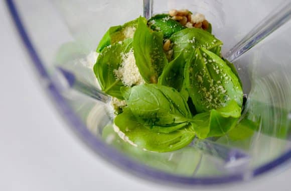 Basil pesto ingredients inside a blender