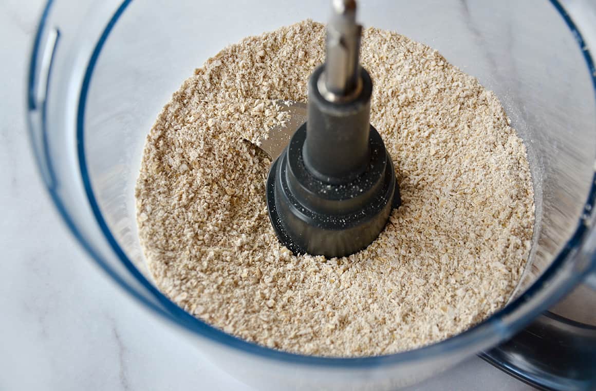 Food processor bowl containing blended oats