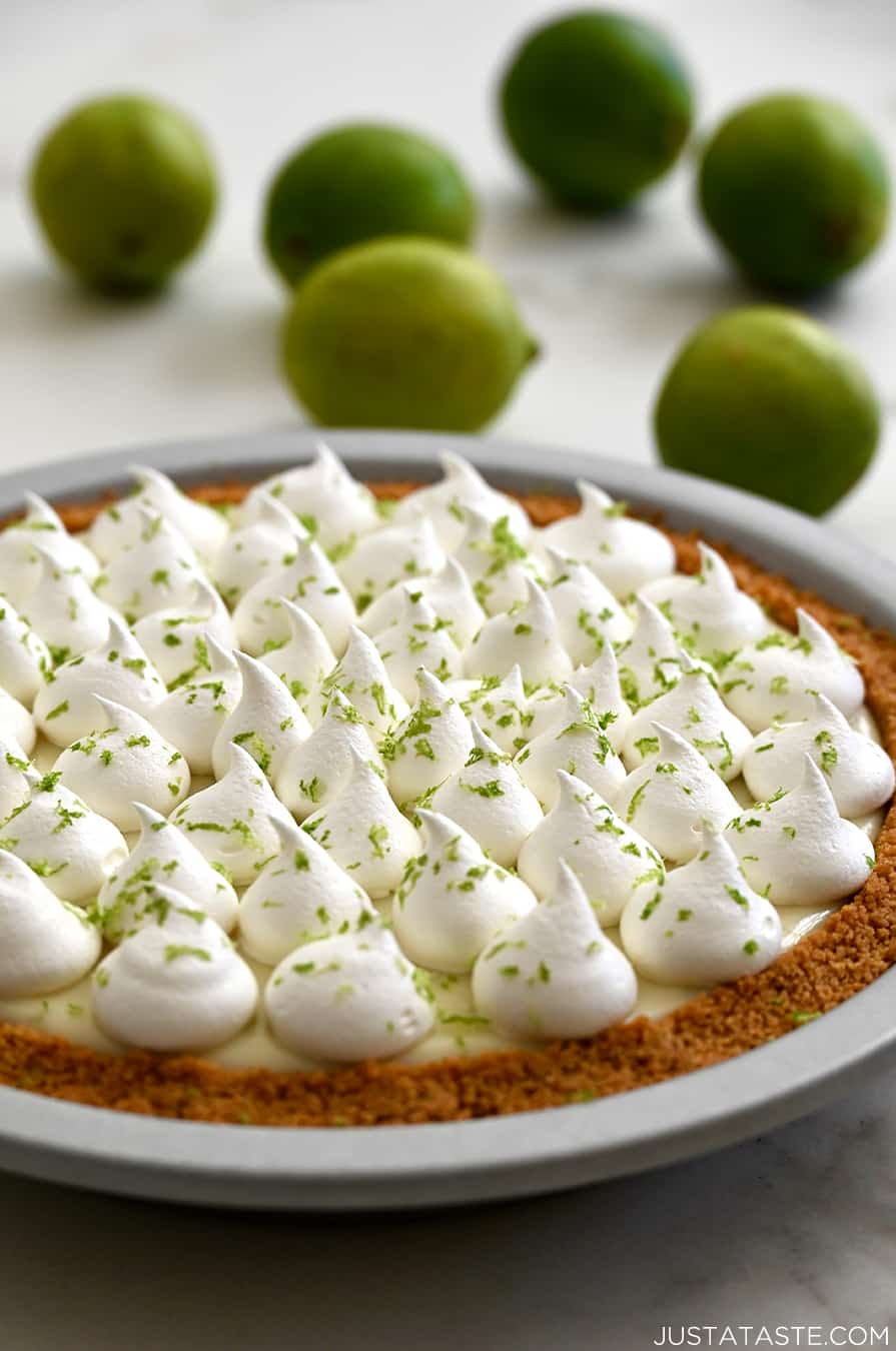 A pie plate containing key lime pie with a homemade graham cracker crust