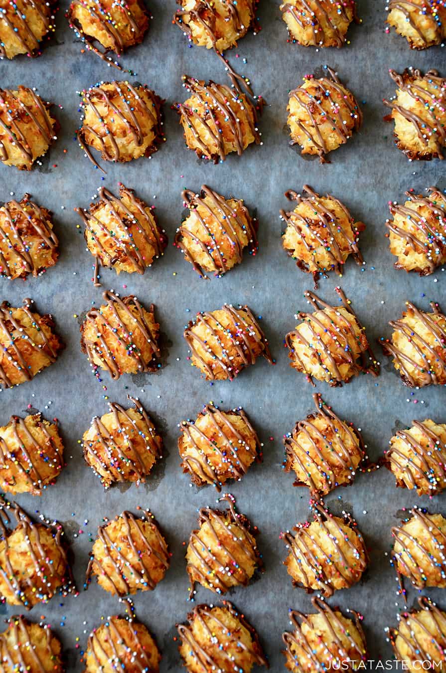 A top-down view of coconut macaroons drizzled with milk chocolate
