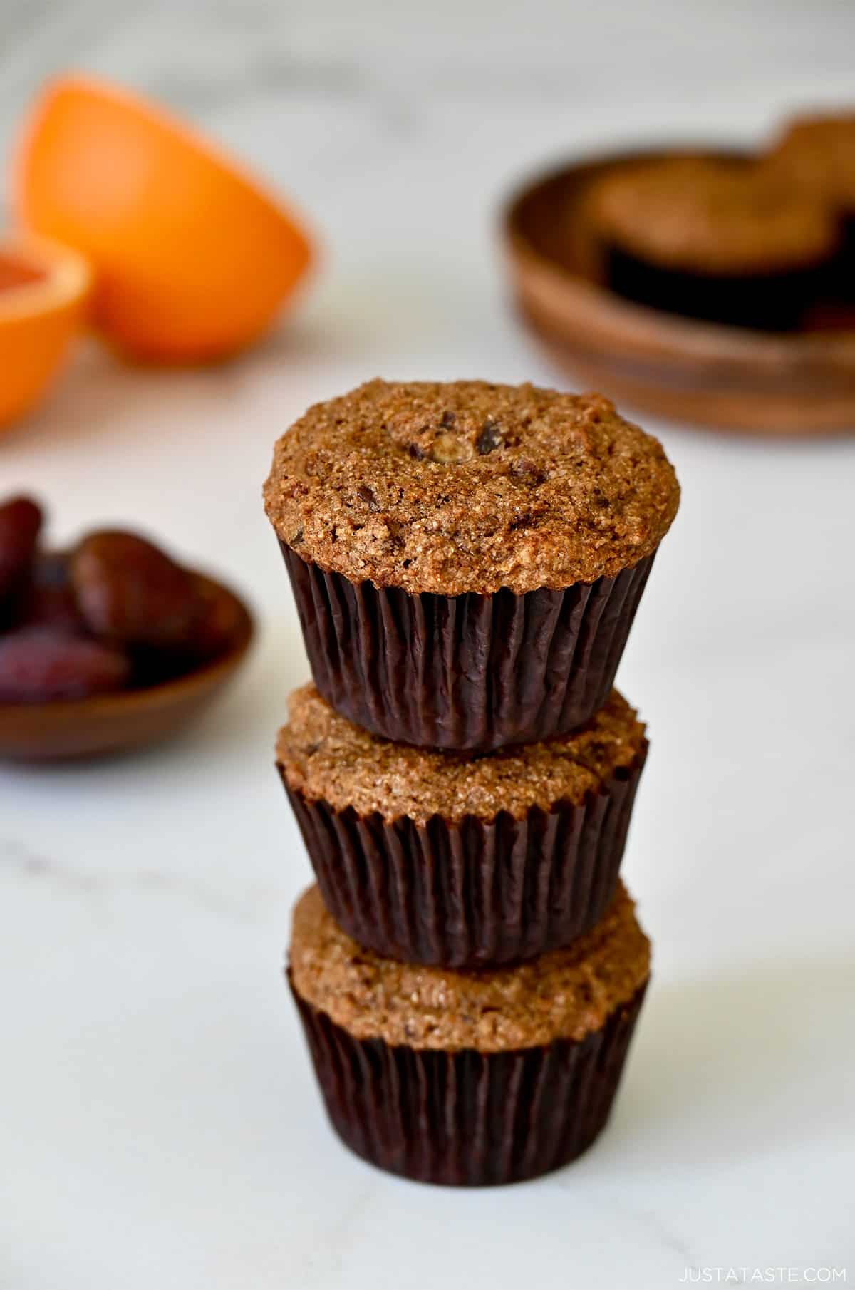 Healthy bran muffins with orange zest stacked three high.