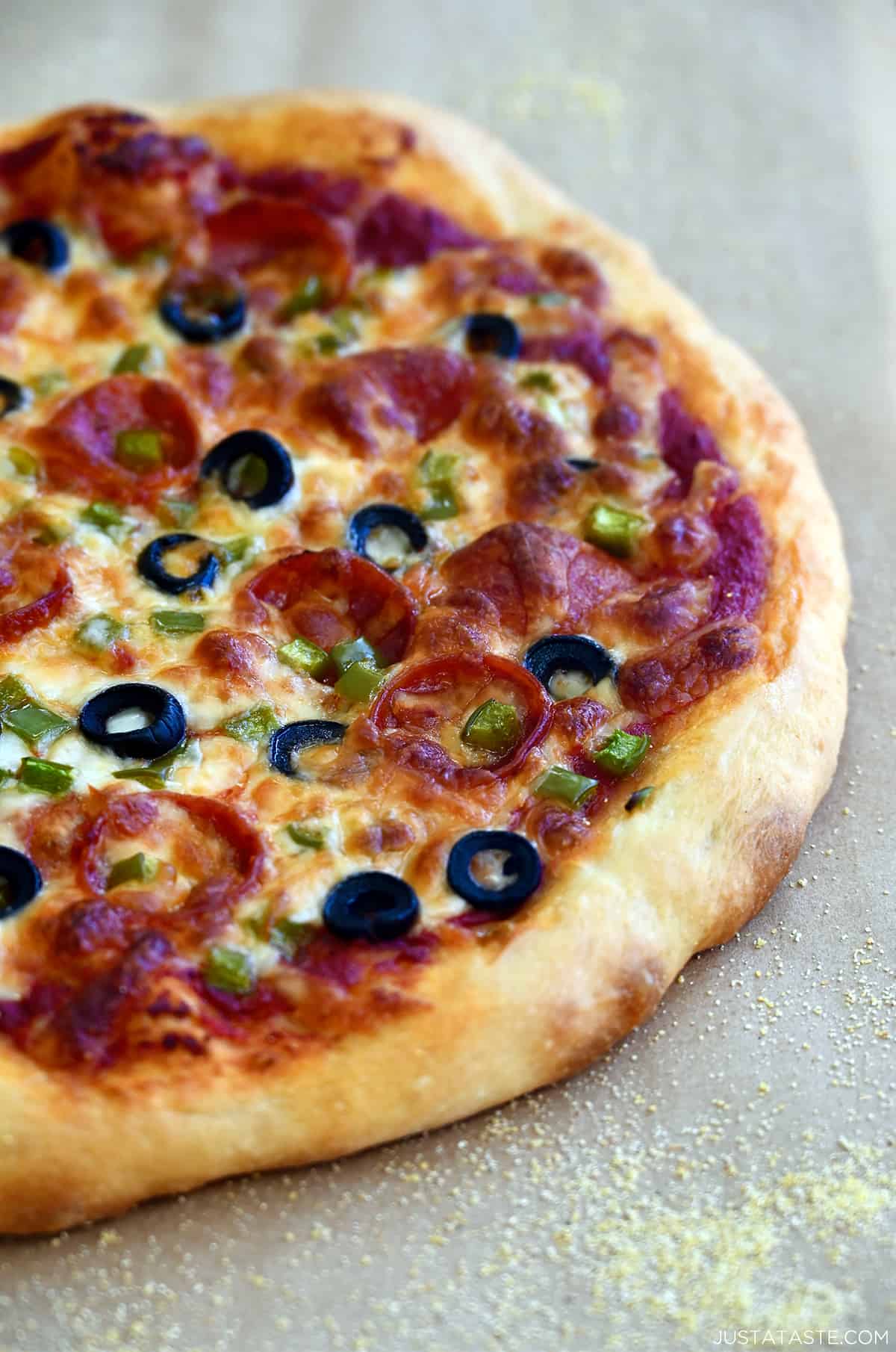 A soft pizza crust topped with marinara sauce, black olives, pepperoni, green peppers and mozzarella cheese.