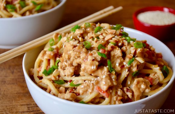 Dan Dan Noodles with Chicken in white bowl with chopsticks