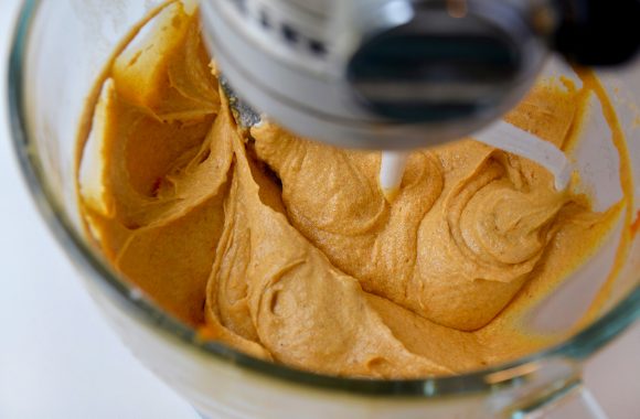 The Best Pumpkin Bread batter in clear stand mixer bowl