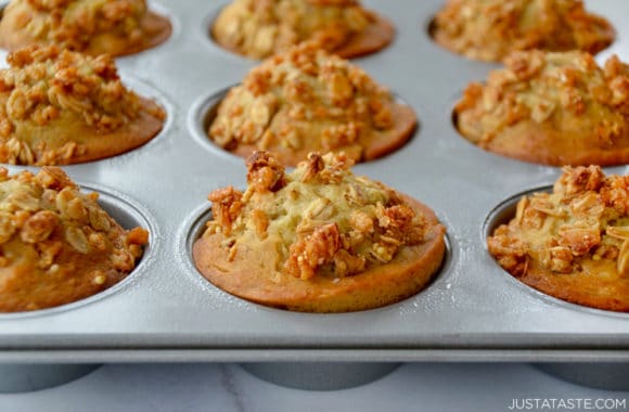 Closeup of baked muffins in greased muffin pan