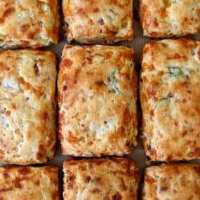 Golden brown bacon-cheddar biscuits with scallions.