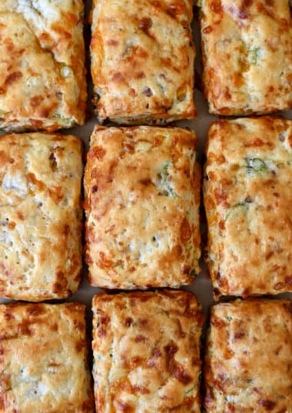 Golden brown bacon-cheddar biscuits with scallions.