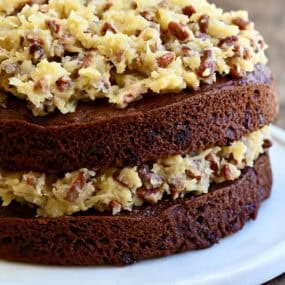 A two-layer German chocolate cake with a toasted pecan coconut frosting sandwiched between the layers.