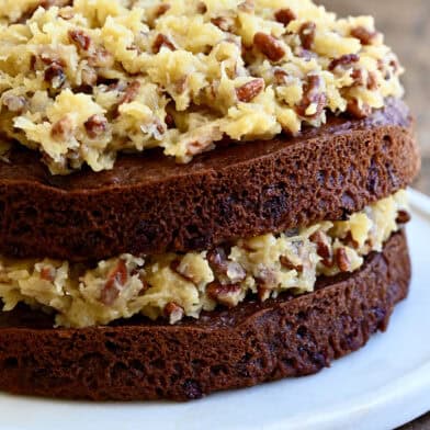 A two-layer German chocolate cake with a toasted pecan coconut frosting sandwiched between the layers.