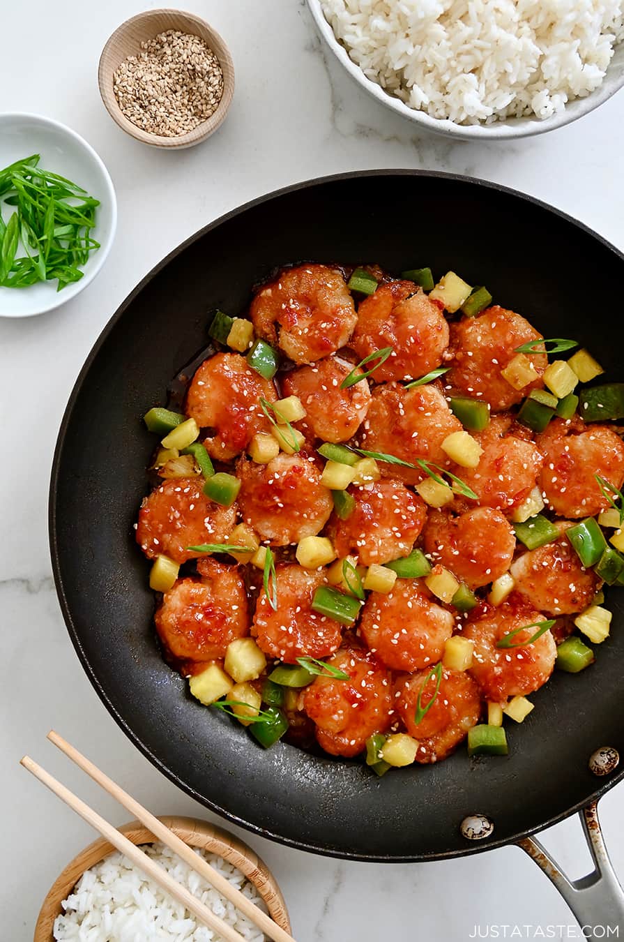 Sweet and Sour Shrimp in a large nonstick skillet with pineapple chunks and sliced green pepper