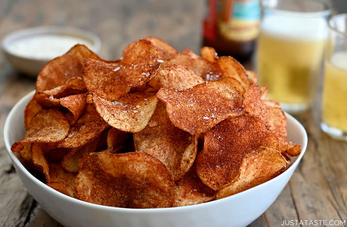 The best homemade barbecue potato chips piled high in a large white serving bowl