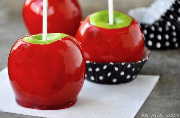 Candy apples in cupcake wrappers on a baking sheet