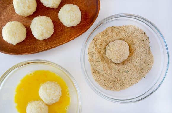 Arancini dipped in eggs and breadcrumbs 