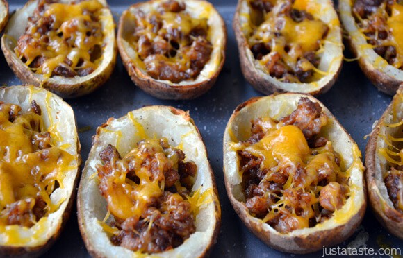 Baked potato skins filled with chorizo and topped with grated cheddar cheese.