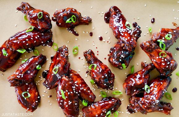 The best baked asian chicken wings garnished with sesame seeds and sliced scallions