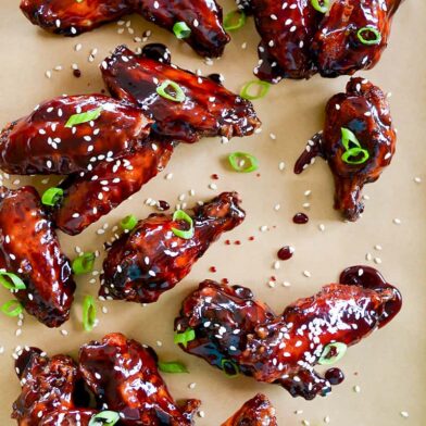 Crispy Baked Asian Chicken Wings topped with sesame seeds and chopped scallions