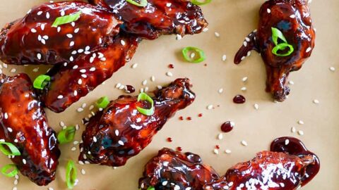 Crispy Baked Asian Chicken Wings topped with sesame seeds and chopped scallions