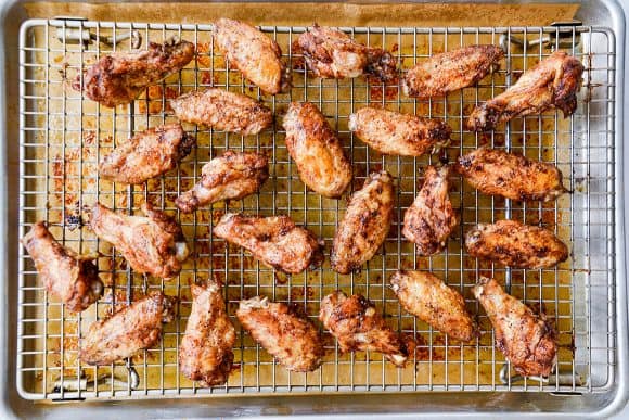 Cooling rack with wings over parchment paper-lined baking sheet 