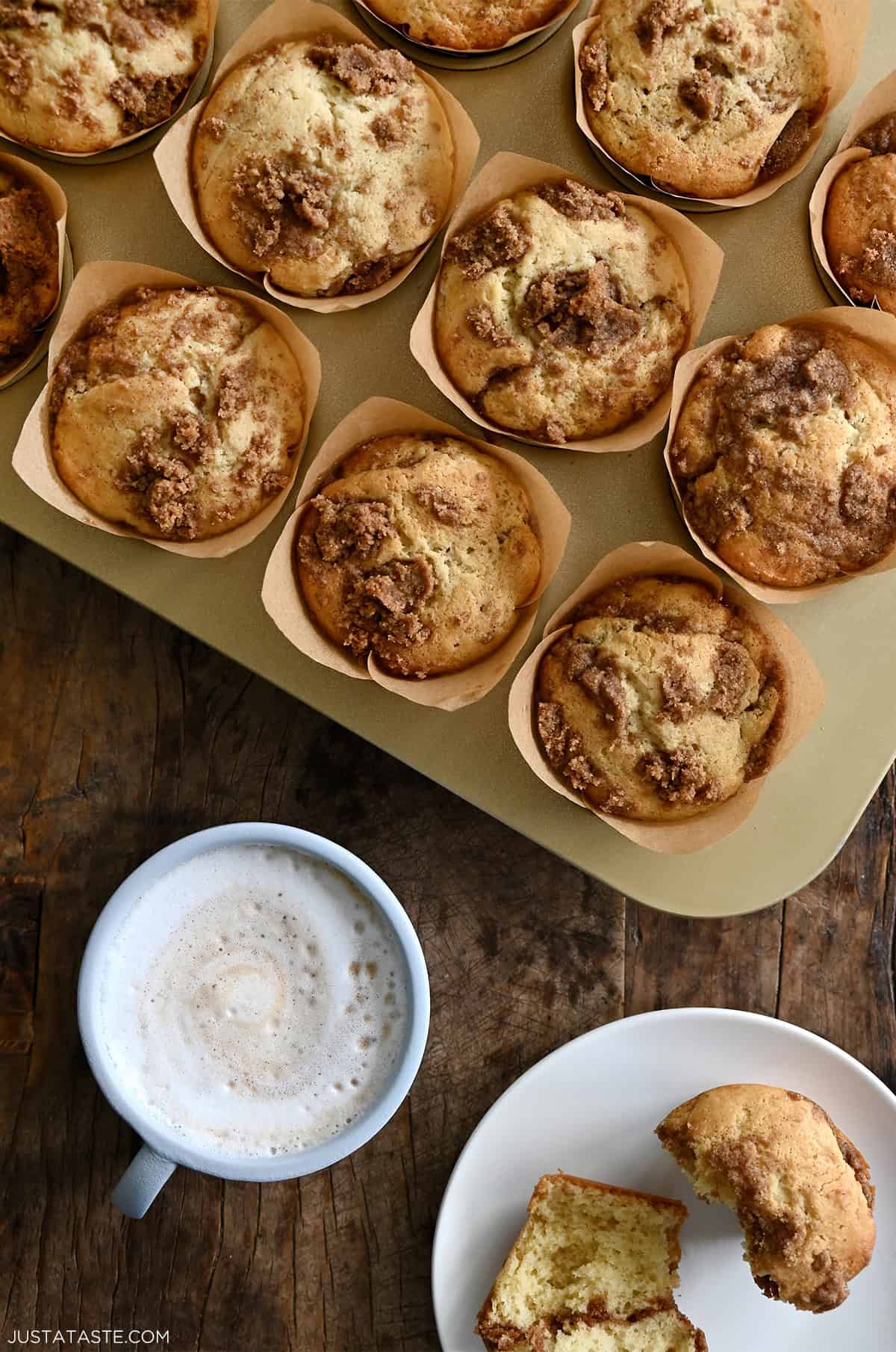 Bakery-style sour cream coffee cake muffins with a cinnamon streusel center and topping. 