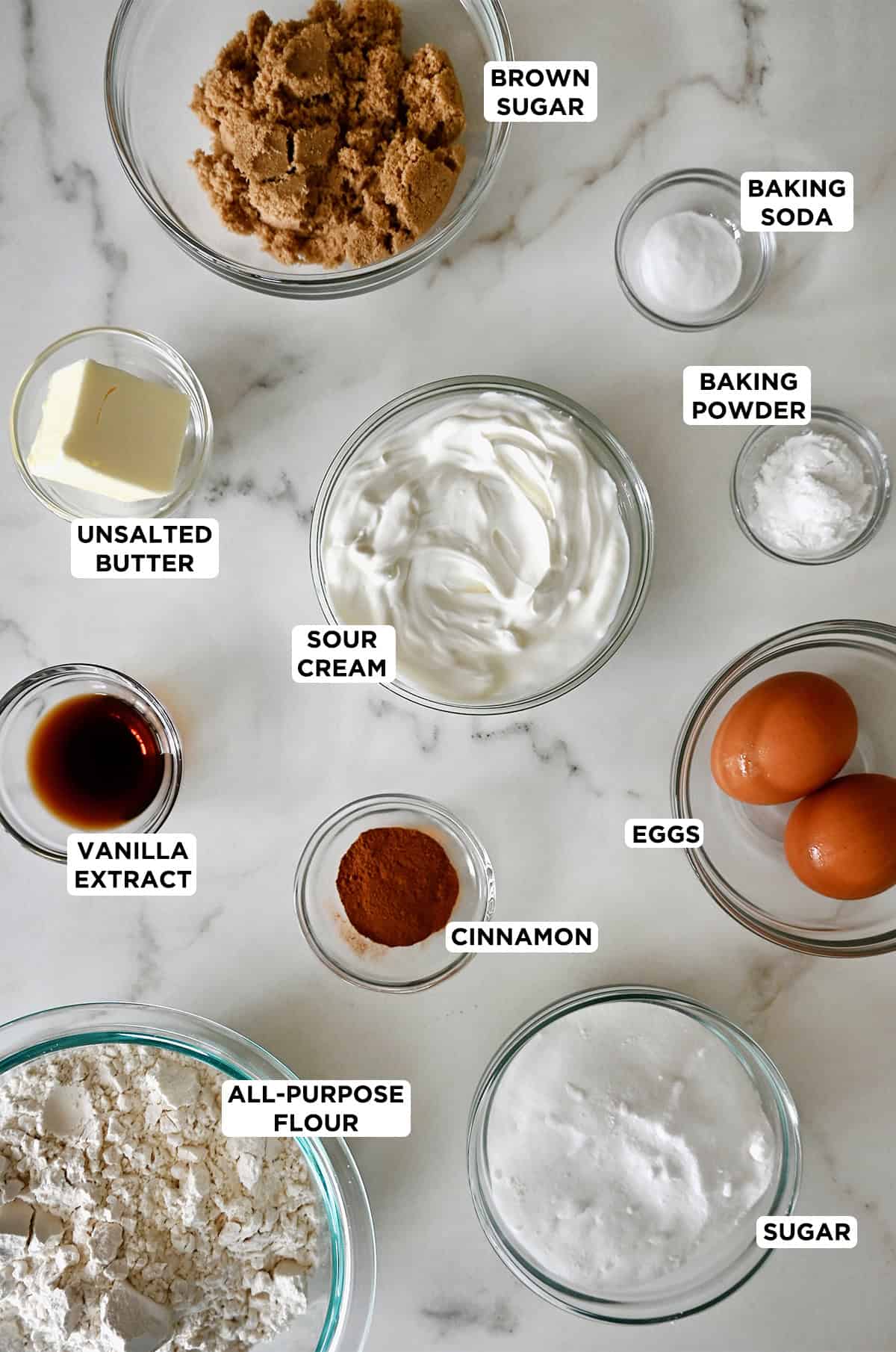 Ingredients to make coffee cake muffins with a cinnamon streusel topping.
