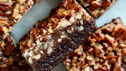 Fudgy pecan pie brownies with a thick layer of pecan pie filling.