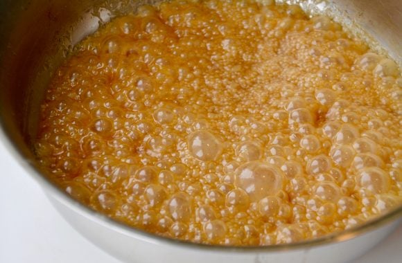 Easy homemade butterscotch boiling in saucepan