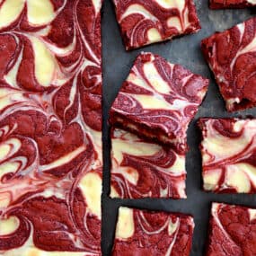 The best Red Velvet Cheesecake Brownies sliced into perfect squares