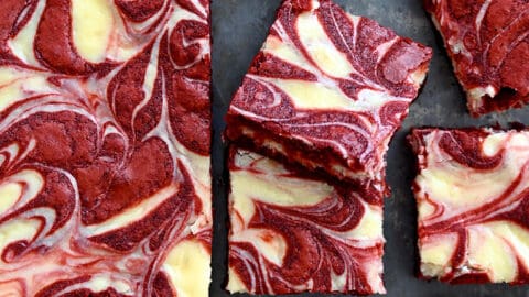 The best Red Velvet Cheesecake Brownies sliced into perfect squares