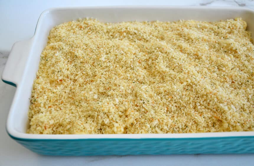 A side view of a baking dish with breadcrumbs 