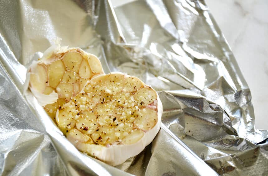 A heard of roasted garlic in foil