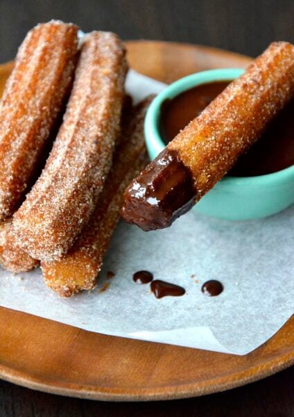 Easy Homemade Churros dipped in chocolate sauce