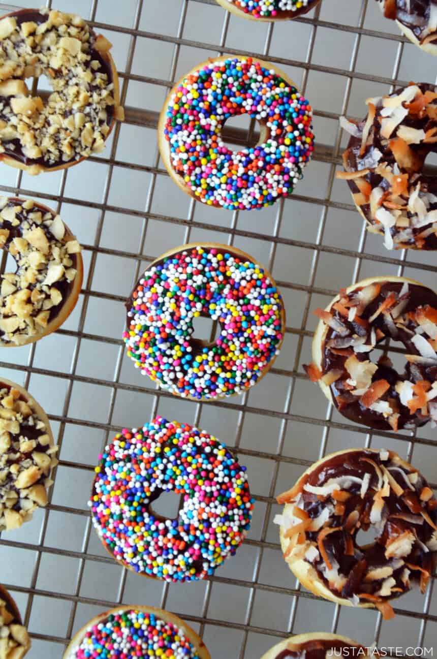 Baked Mini Buttermilk Doughnuts with Nutella Glaze and sprinkles, nuts and coconut toppings