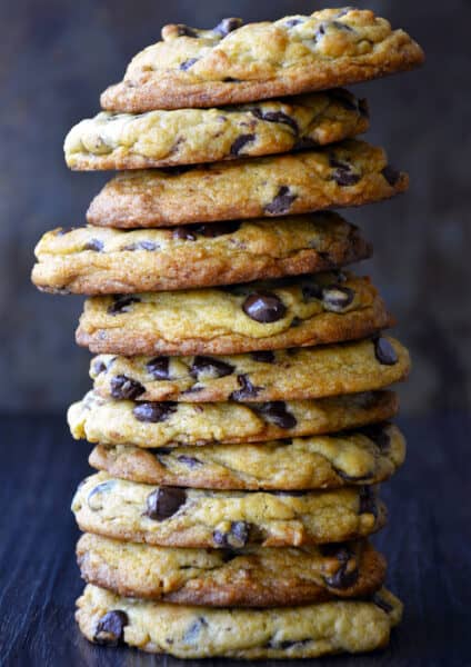 A tall stack of Secret Ingredient Chocolate Chip Cookies made with cream cheese.