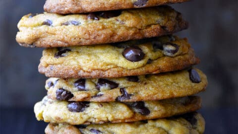 A tall stack of Secret Ingredient Chocolate Chip Cookies made with cream cheese.