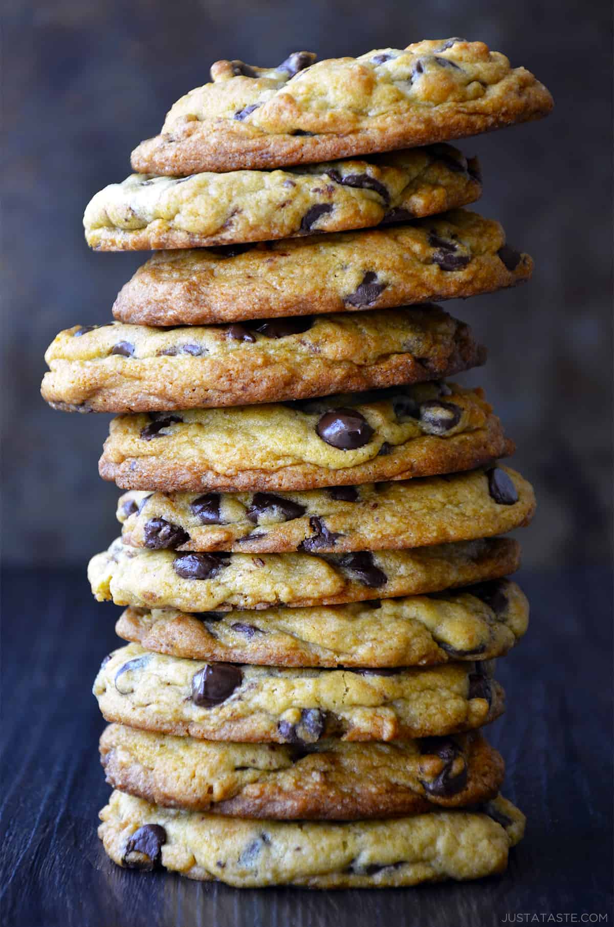 A tall stack of Secret Ingredient Chocolate Chip Cookies made with cream cheese.
