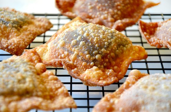 A cooling rack containing chocolate wontons