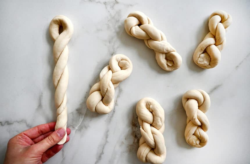 A top-down view of unbaked dough shaped into twists