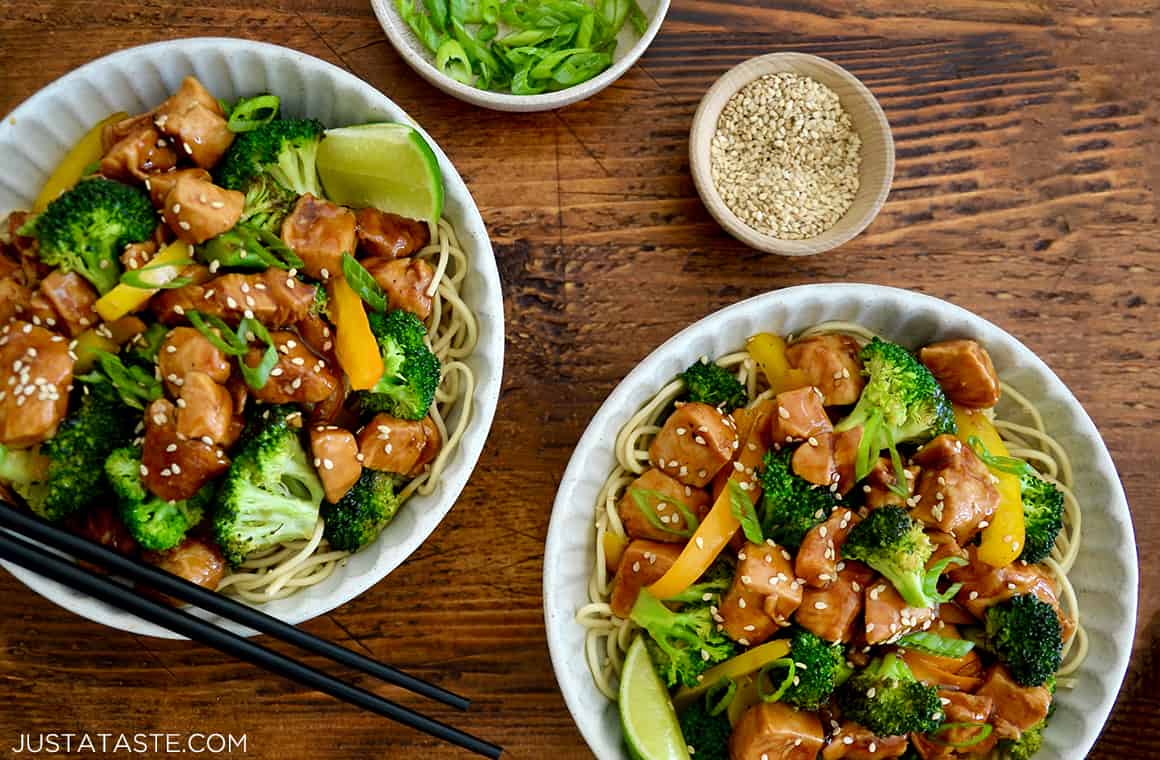 Two white bowls containing homemade 30-Minute Chicken and Broccoli Stir-Fry