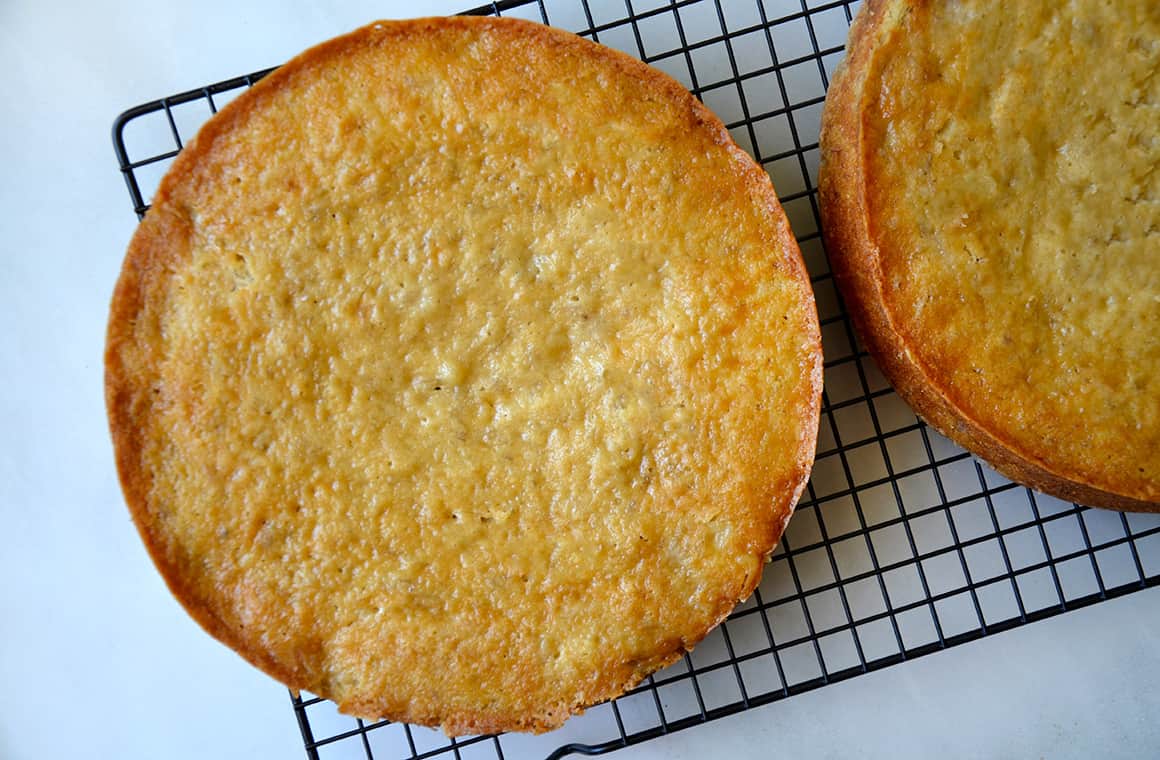 Freshly baked cakes cooling on a wire rack