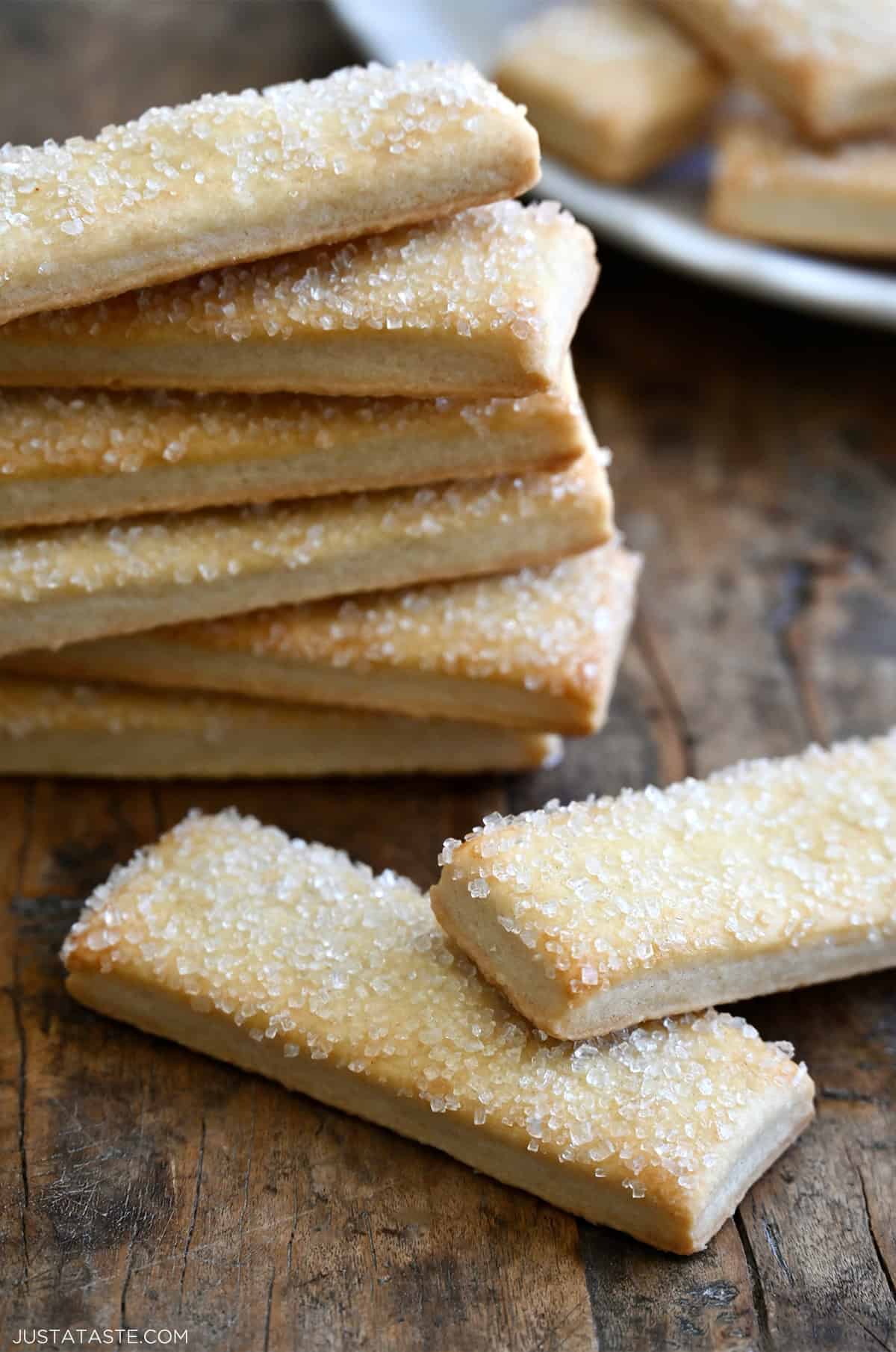 Pie crust cookies topped with sanding sugar stacked six high. 