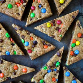 The best monster cookie bars sliced into triangles
