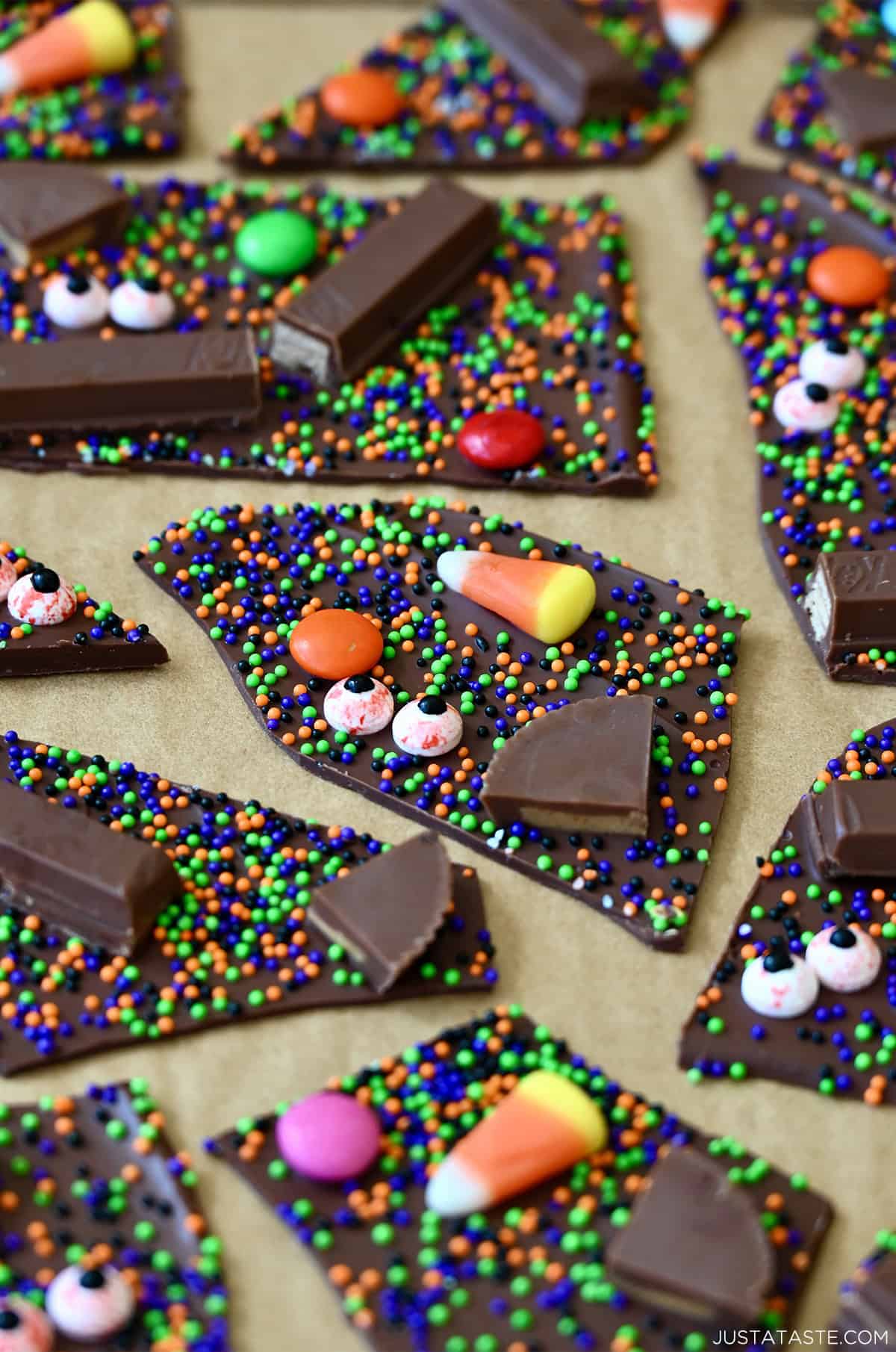Cut Halloween candy bark on parchment paper.