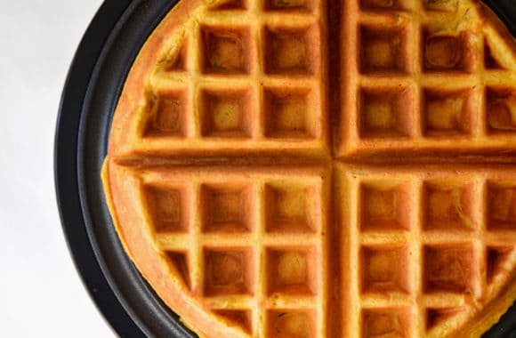 Cooked pumpkin spice waffle in waffle maker
