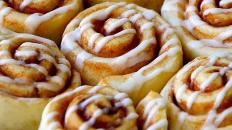 Pizza Dough Cinnamon Rolls with glaze on serving plate