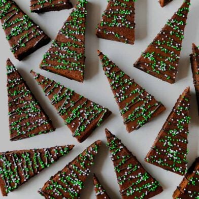 A view of Christmas Brownies drizzled with chocolate and topped with sprinkles