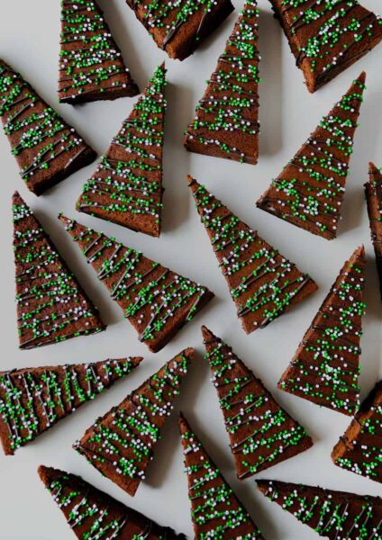 A view of Christmas Brownies drizzled with chocolate and topped with sprinkles